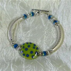 Fair Trade Kazuri  Green Bead Bracelet with Silver Bangle .