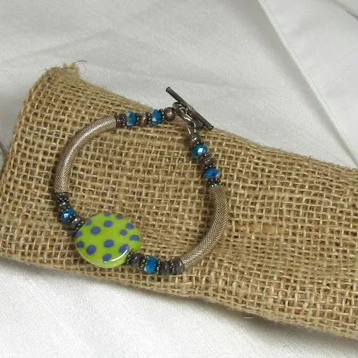 Fair Trade Kazuri  Green Bead Bracelet with Silver Bangle .